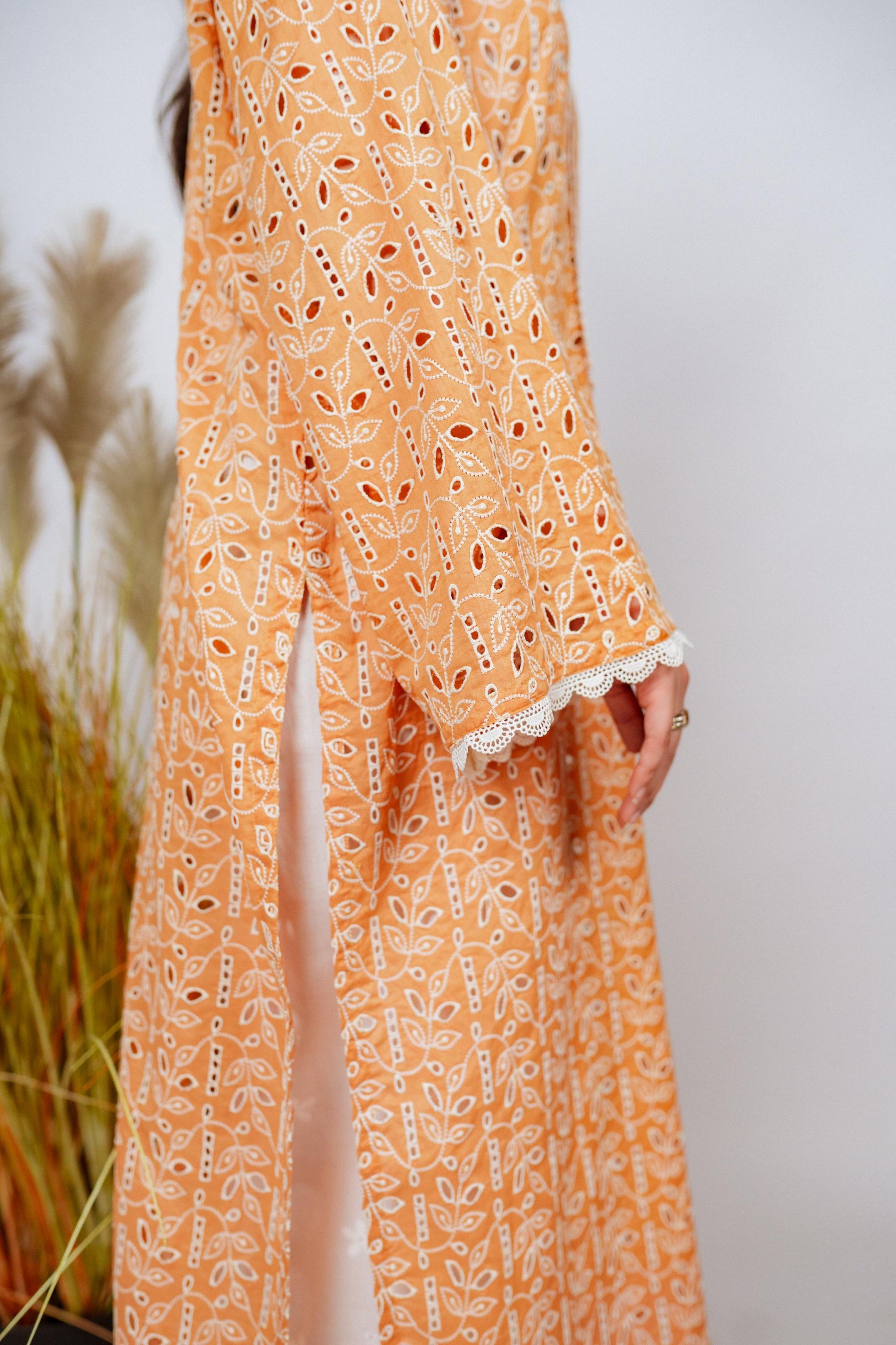 Mustard Chikan kurta with off-white floral embroidery and lace neckline