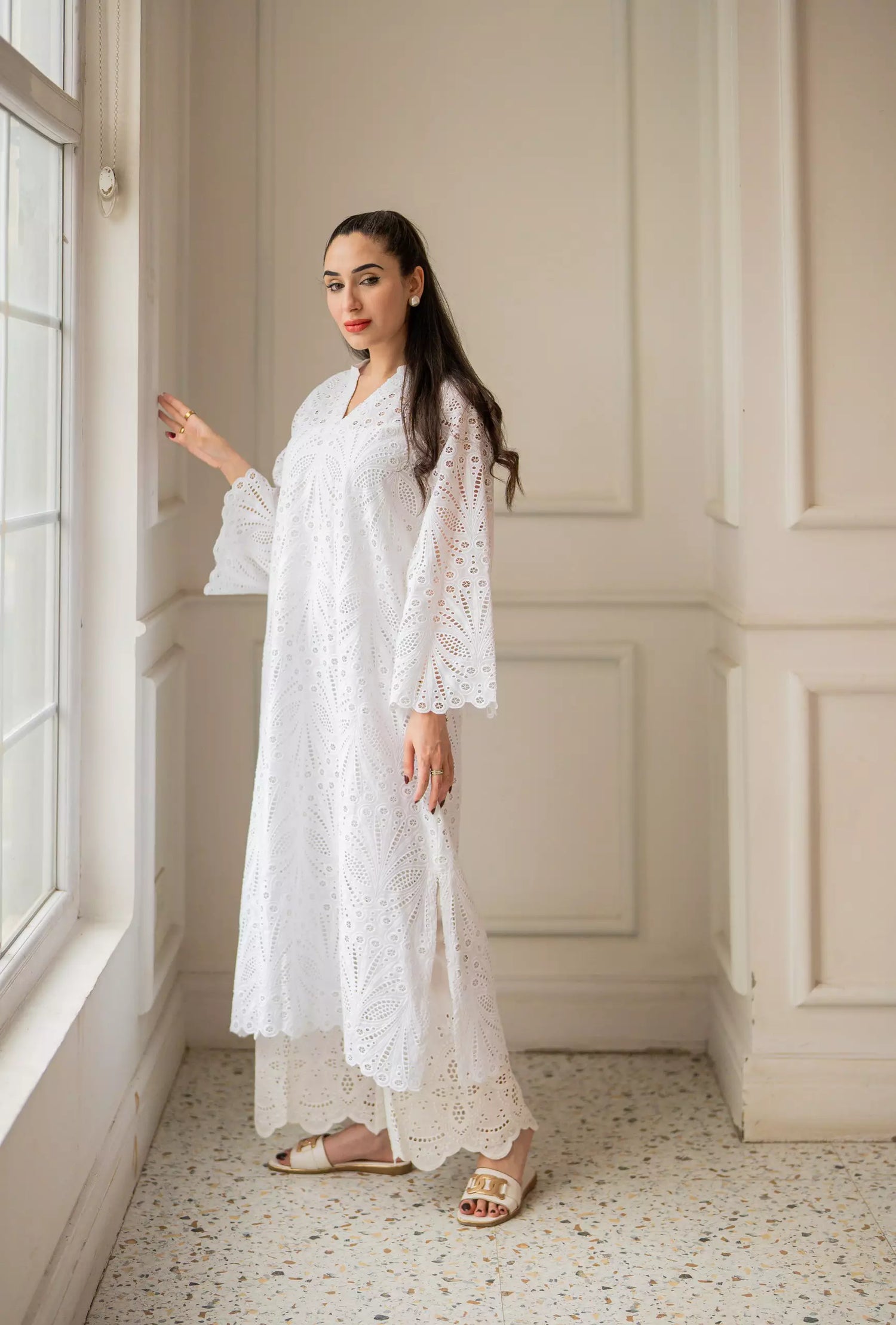 White cutwork kurta with flared sleeves and V-neckline