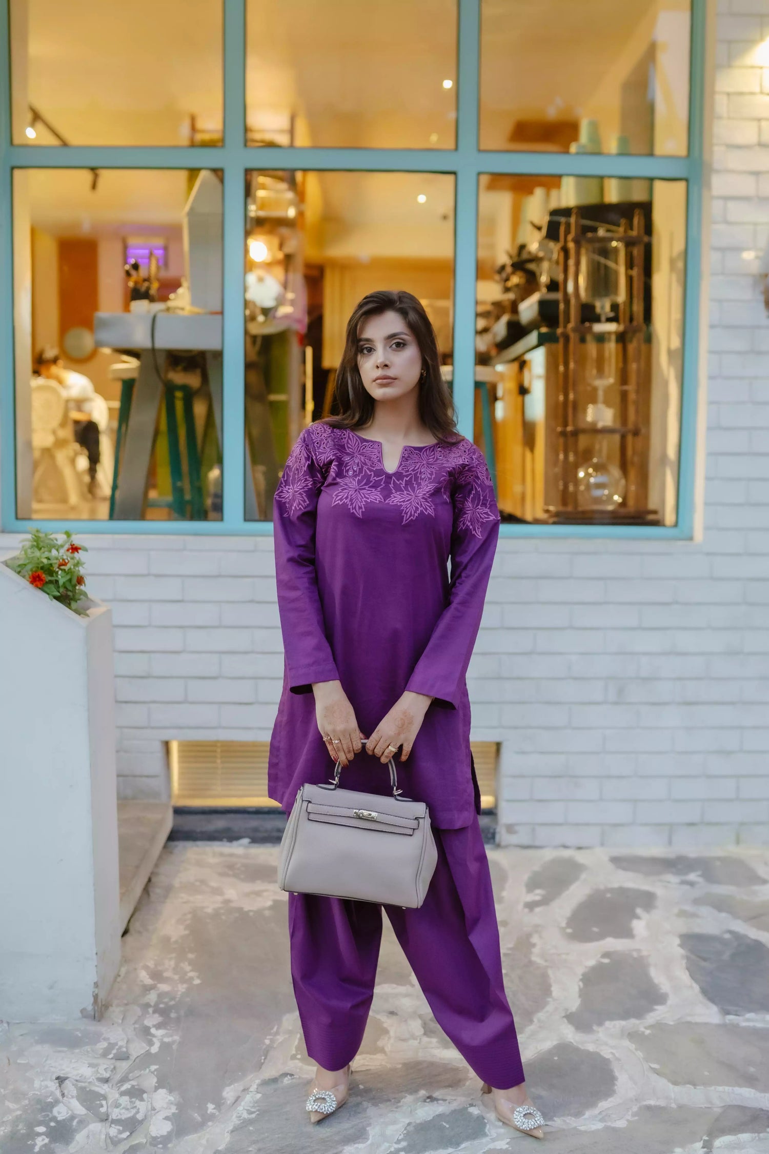 Woman wearing plum embroidered kurta with farshi shalwar
