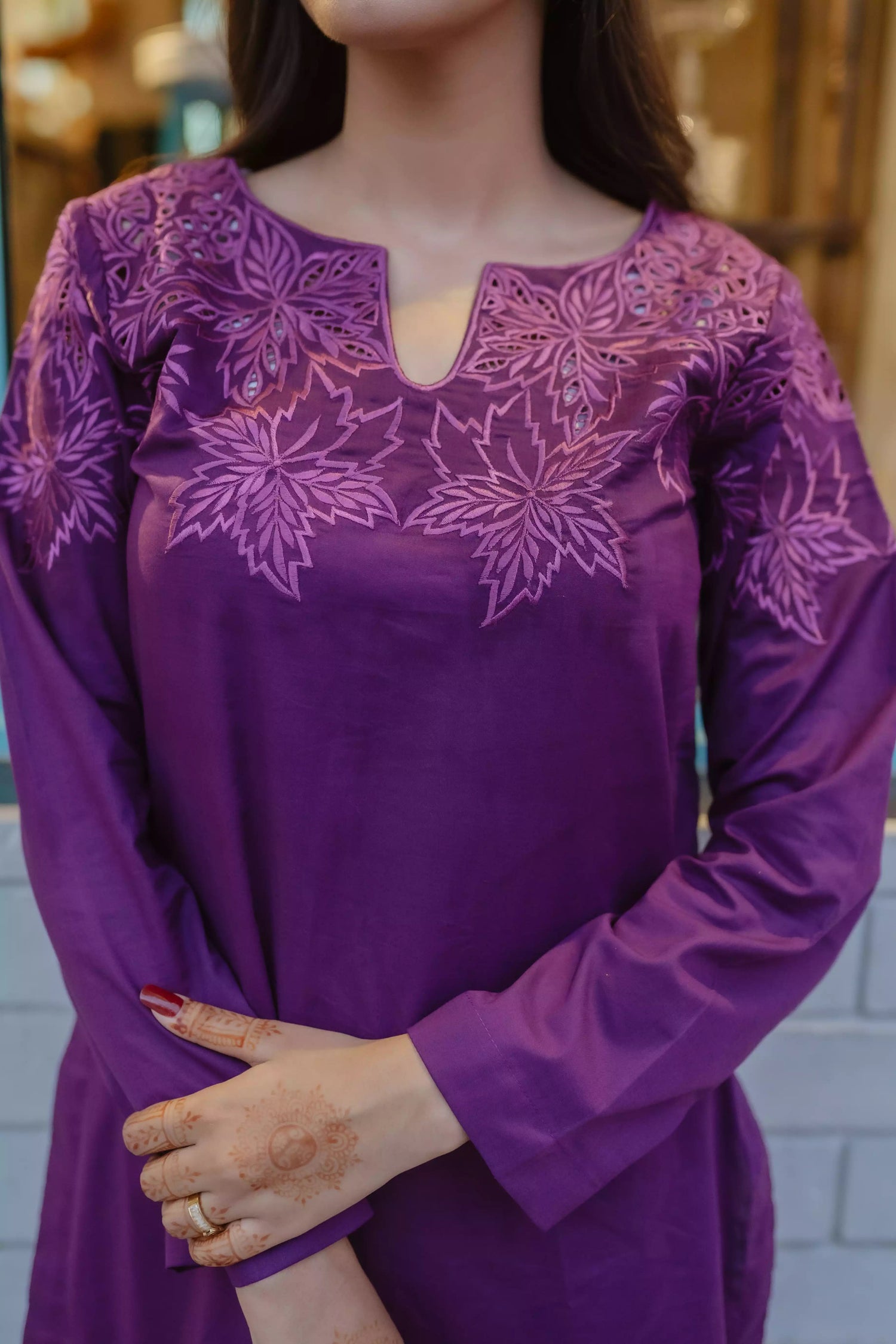 Woman wearing plum embroidered kurta with farshi shalwar