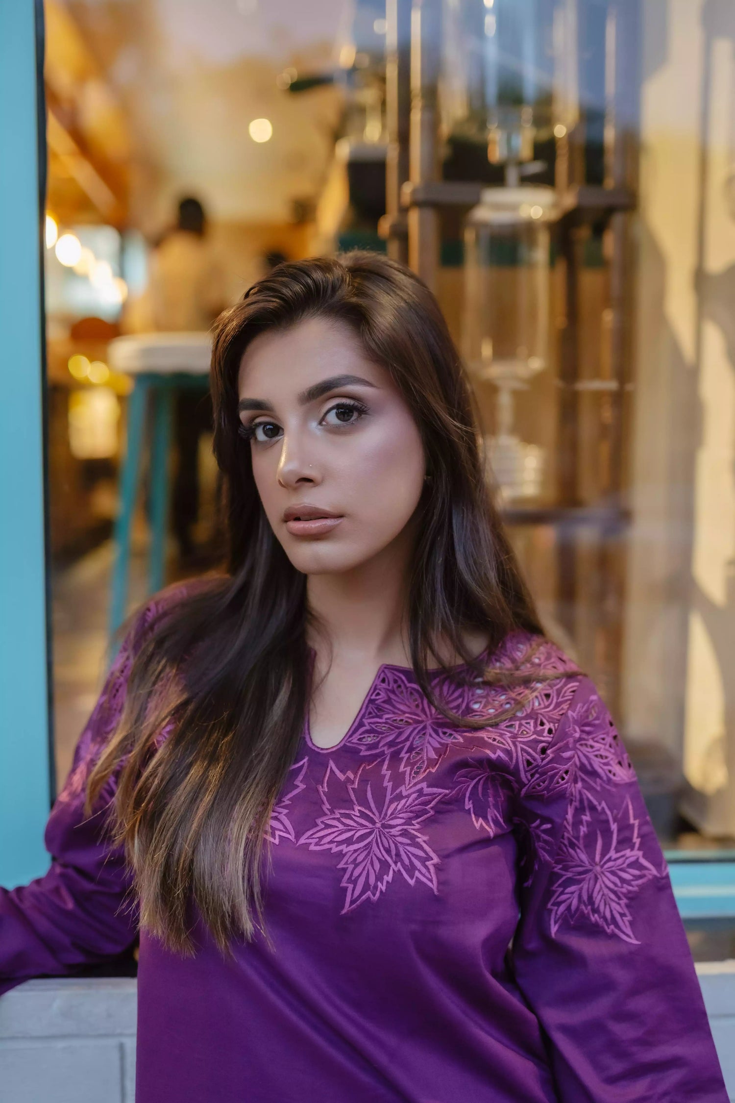 Woman wearing plum embroidered kurta with farshi shalwar