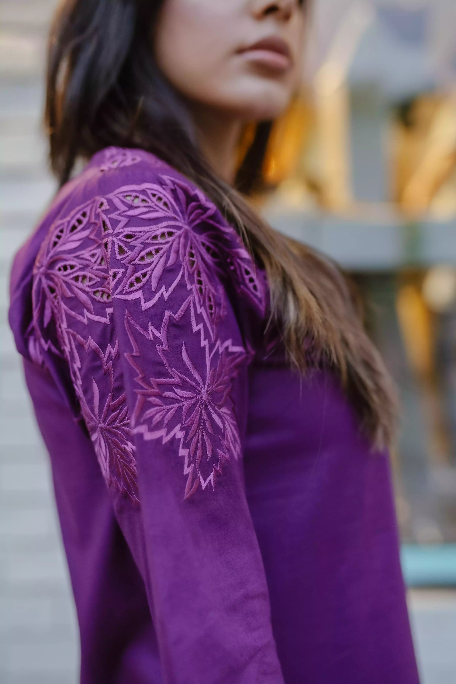 Woman wearing plum embroidered kurta with farshi shalwar