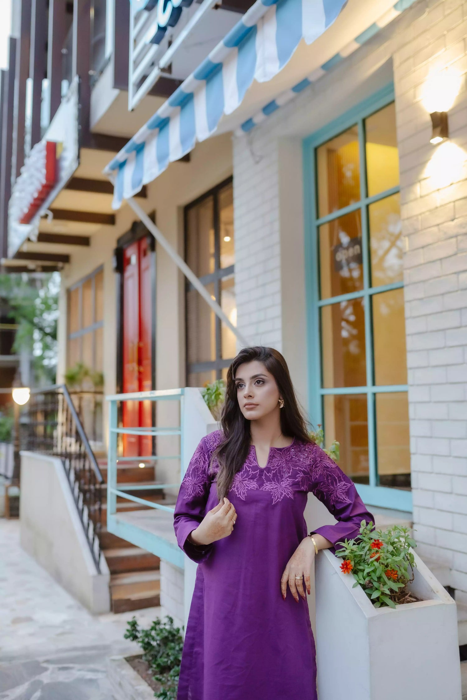 Woman wearing plum embroidered kurta with farshi shalwar