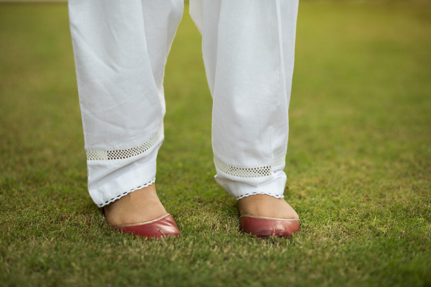Traditional white cotton shalwar with lace-edged hem and center fill